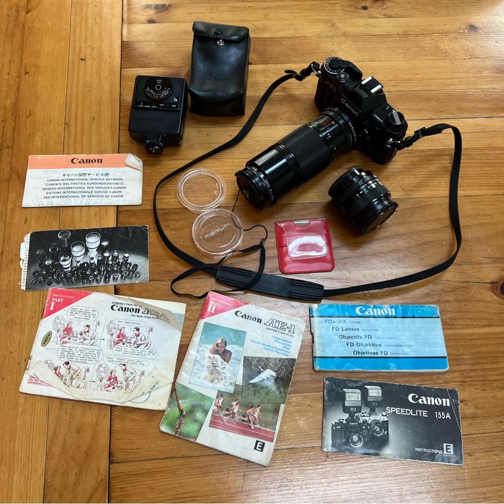 Vintage Canon AE-1 camera 2 lenses speed light manuals